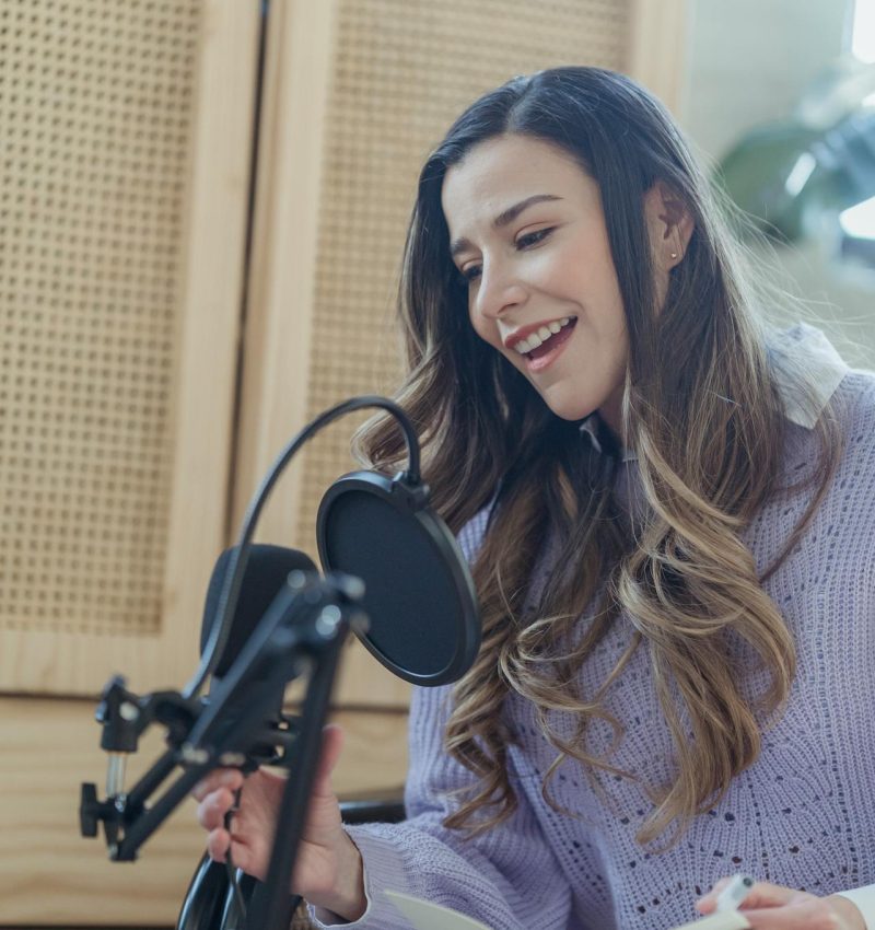 woman speaking into radio mic